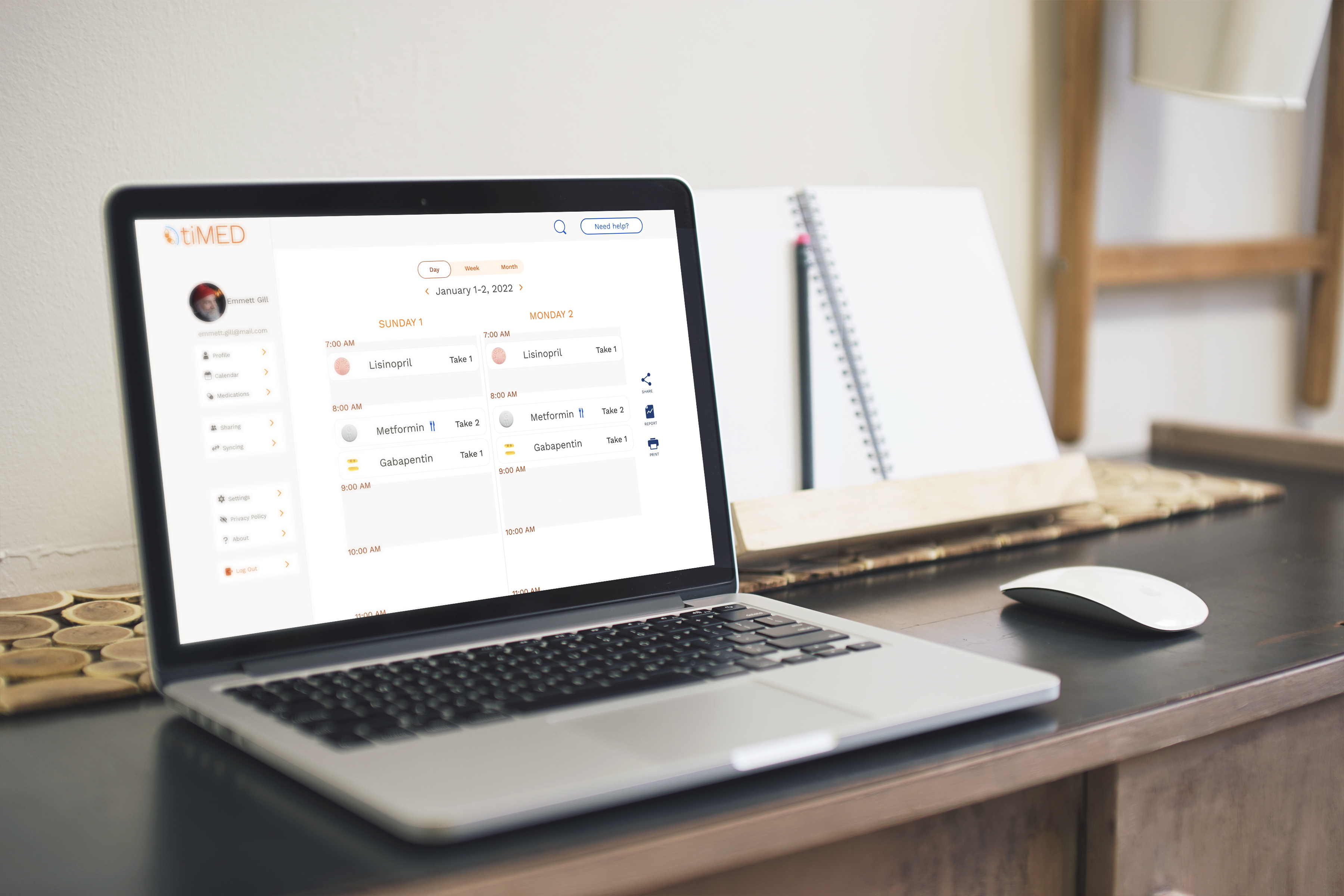 Open laptop on a desk showing a two-day medication schedule.
