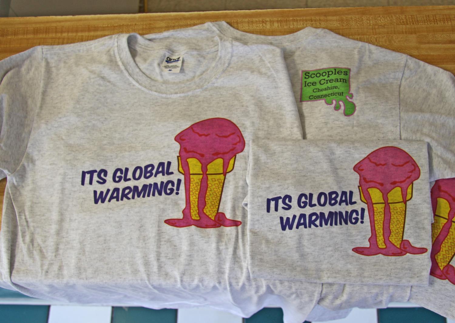 Grey shirts with a graphic of a melting ice cream cone and text that reads "It's global warming!"