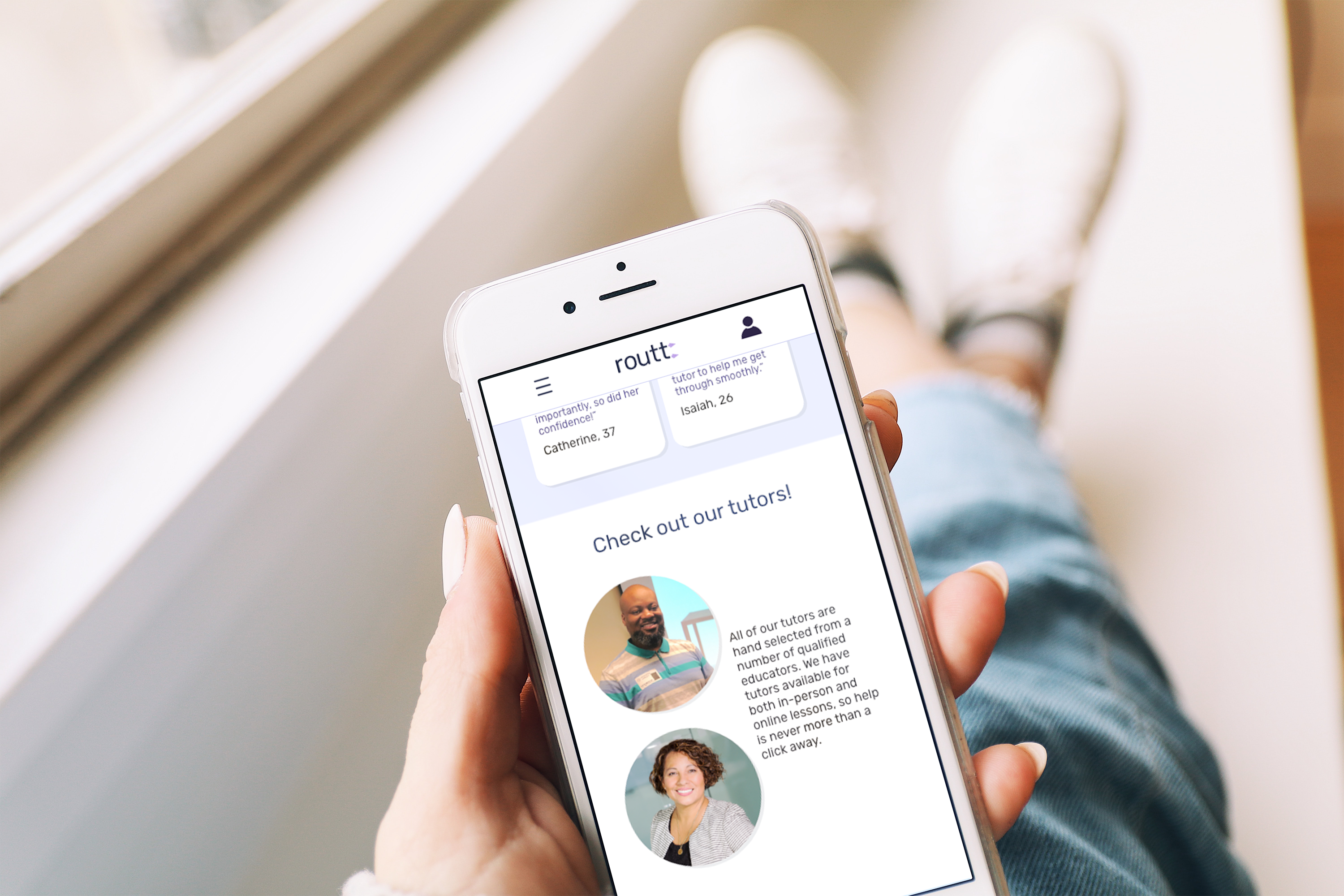 Hand holding a mobile phone with the app open, screen says "check out our tutors!" with two images of adult professionals