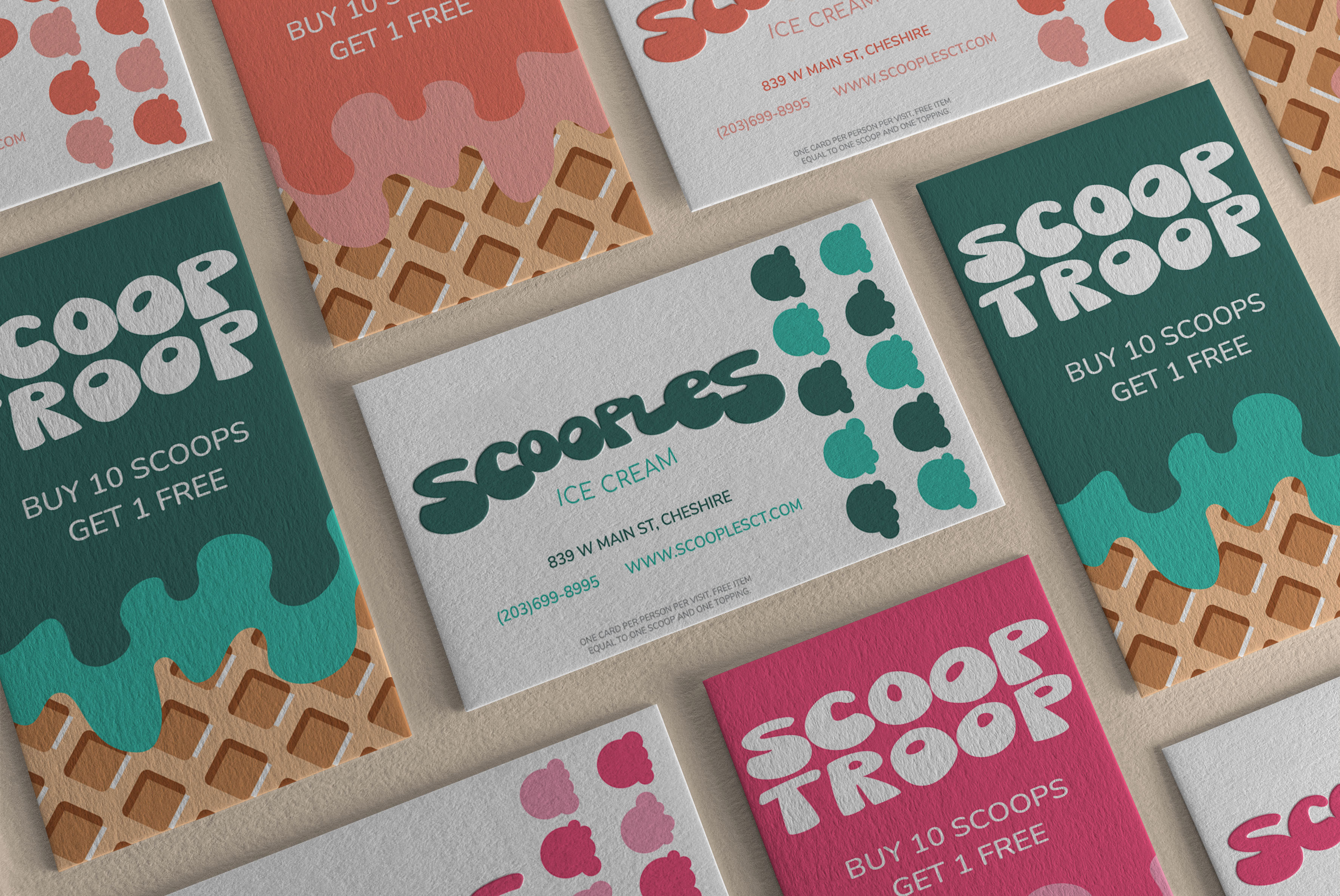Business cards with two rows of ice cream graphics and the name Scoop Troop at the top