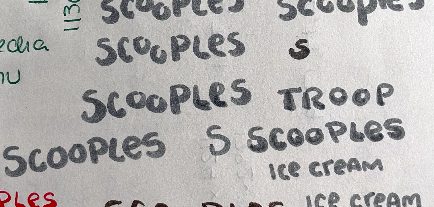 Multiple versions of the name "scooples" handwritten in grey ink on white paper