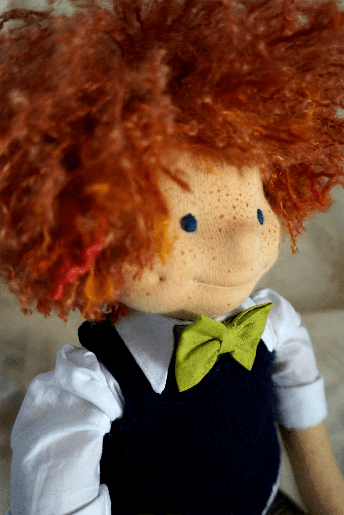 Angus' hair takes up most of the space, but his little green bowtie is still visible