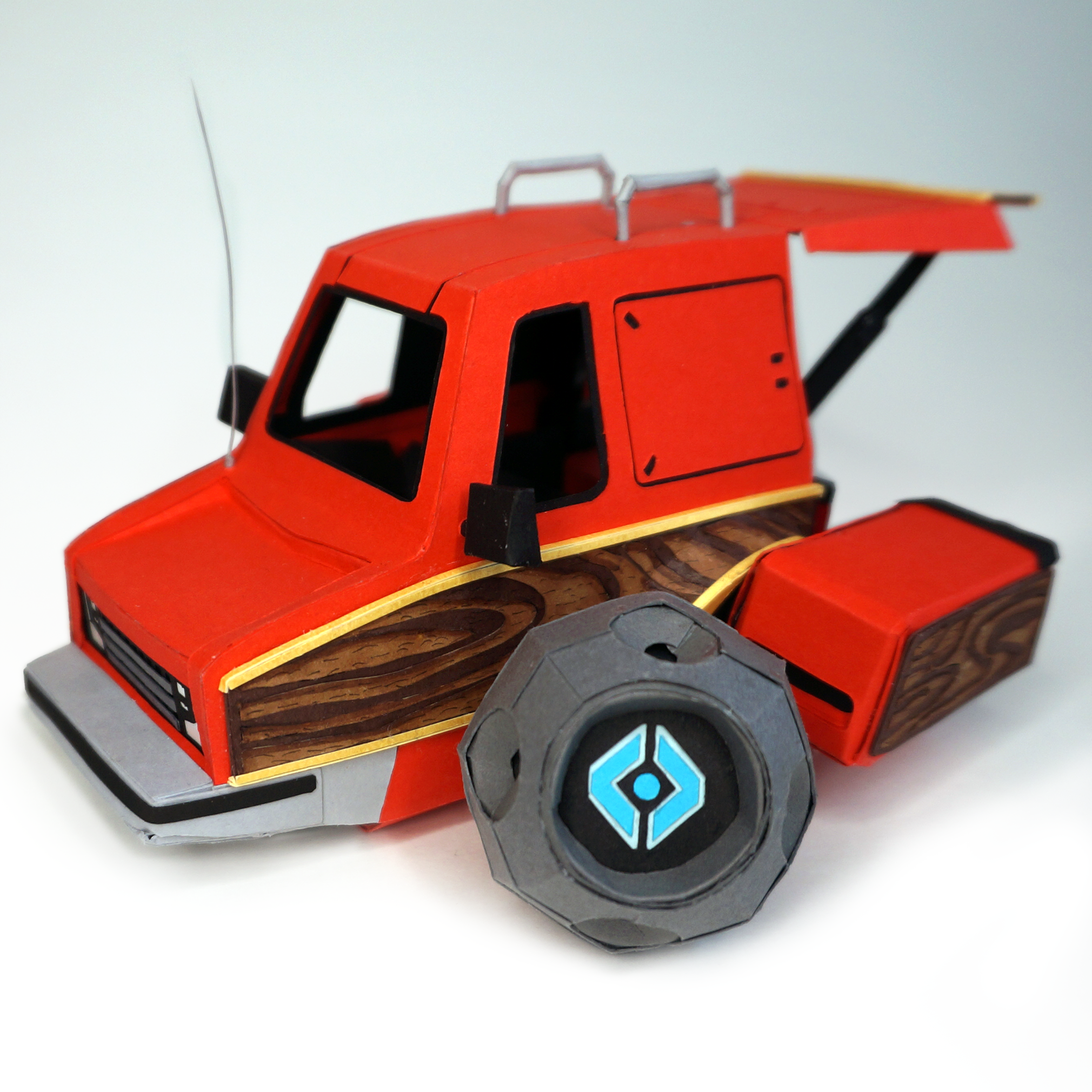 Parked red Vantastic Shell with the back door open and ghost sitting outside