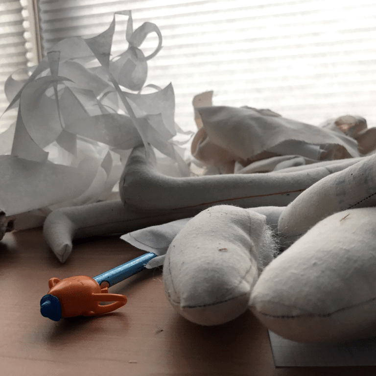 Sewn iterations of body parts and limbs as well as scraps of paper