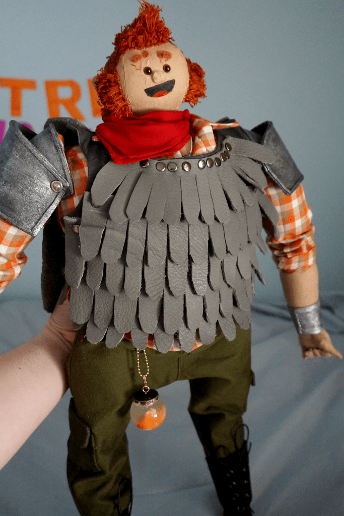 Magnus' wide blocky torso and grey leather feather chestpiece