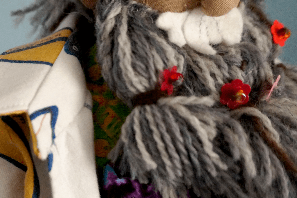 Merle Highchurch's beard with flowers woven in