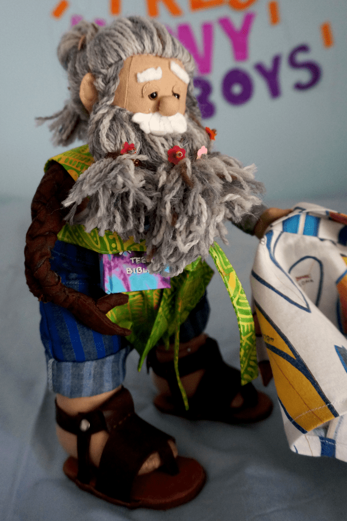 Merle's surfboard shirt comes off to reveal his wooden arm