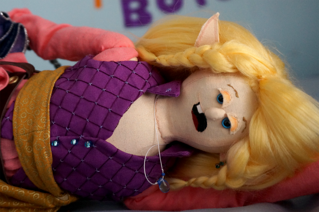 Taako laying and posing as if he's in a magazine