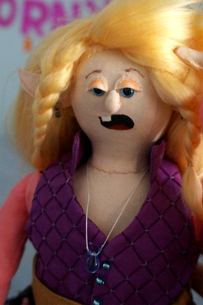 Close up of Taako's face and hair braids